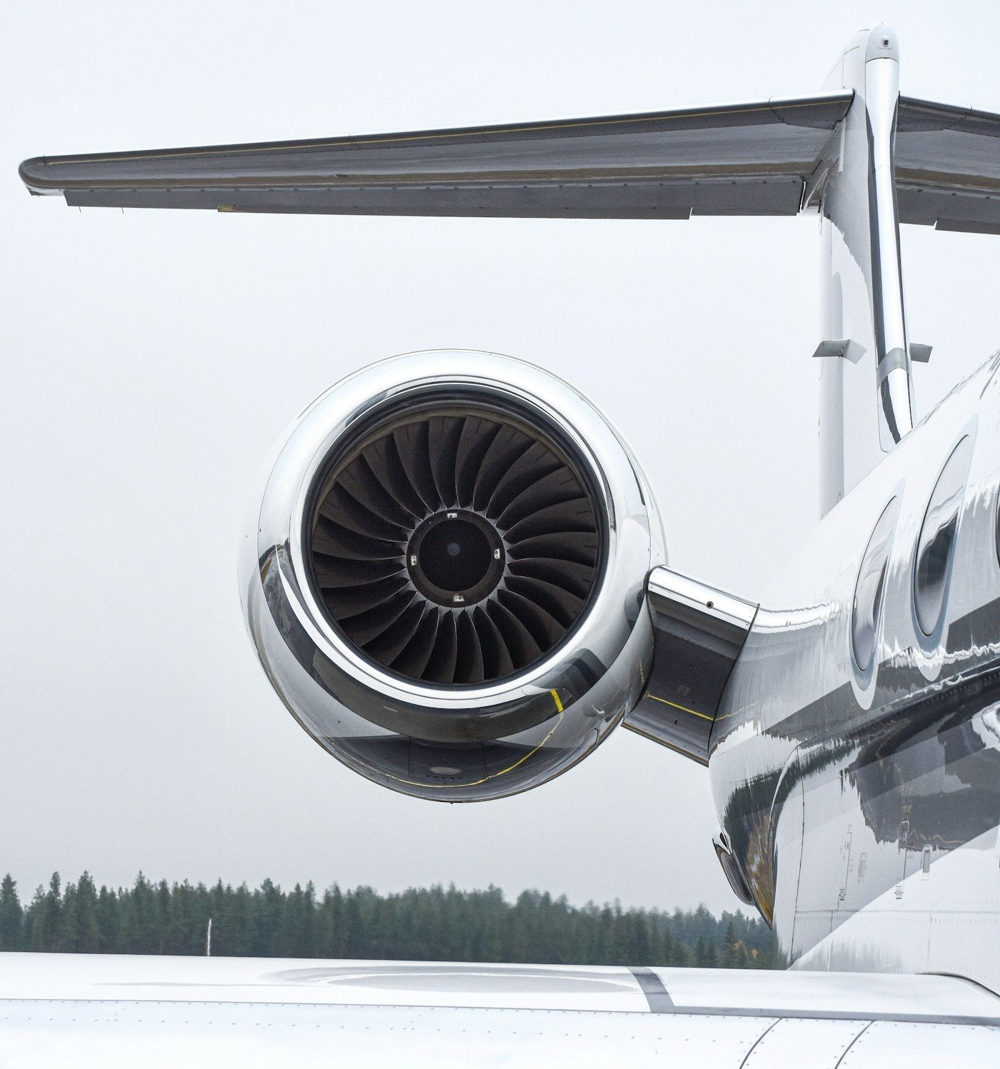 Tail-mounted turbofan nacelle on a business jet, seen from below